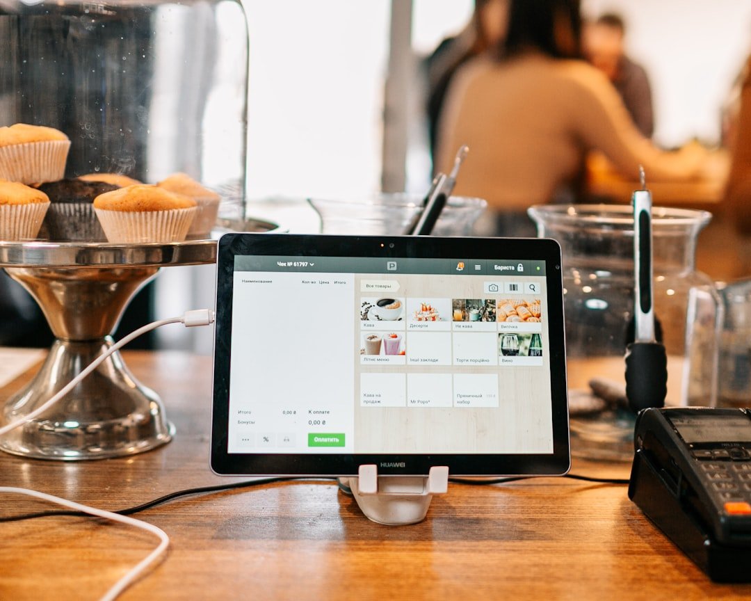 A tablet POS system on a stand at the counter in a bakery